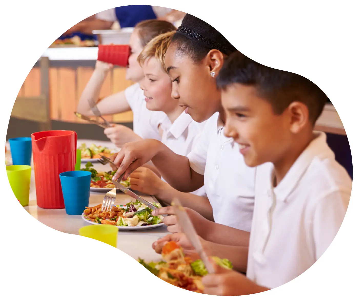 Denbigshire Catering Children eating at school dining table
